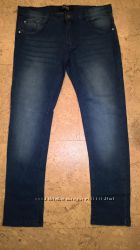 Новые стрейтчевые джинсы для девочки Next синего цвета 10-14 лет