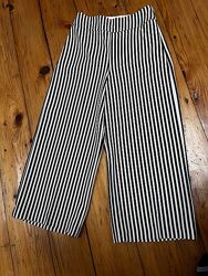 Штани для дівчинки широкі в чорно-білу смужку від New Express.