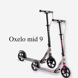 Самокат Oxelo mid 9 з амортизацією та ручним гальмом на кермі. decathlon