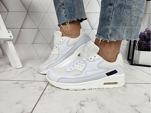 Білі кросівки з компенсатором