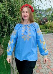 Блакитна жіноча вишиванка з колосками і ластівками