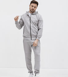 Спортивний костюм із кофтою на застібці та швами на штанах